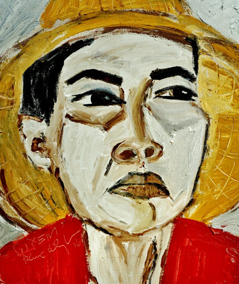 A painting titled ‘GIYEM’ depicts a portrait of the woman wearing a red shirt and a conical hat.